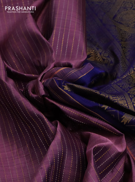 Pure kanchipuram silk saree pastel purple and dark blue with allover zari weaves and long zari woven butta border