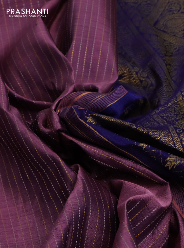 Pure kanchipuram silk saree pastel purple and dark blue with allover zari weaves and long zari woven butta border