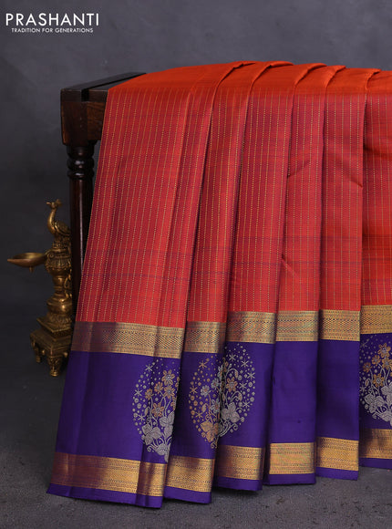 Pure kanchipuram silk saree rustic orange and dark blue with allover zari weaves and long zari woven butta border