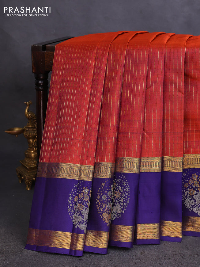 Pure kanchipuram silk saree rustic orange and dark blue with allover zari weaves and long zari woven butta border