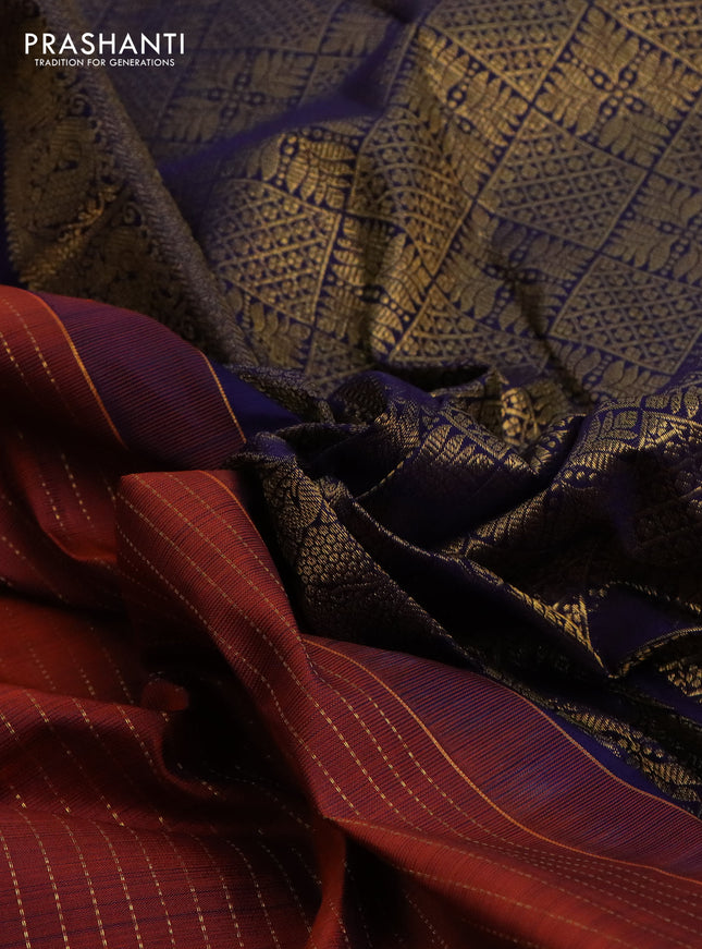 Pure kanchipuram silk saree rustic orange and dark blue with allover zari weaves and long zari woven butta border