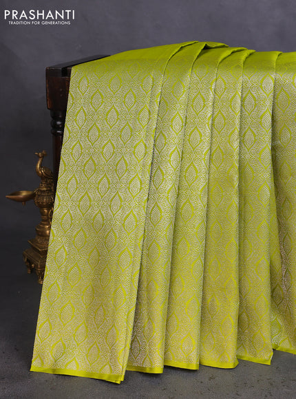 Pure kanchipuram silk saree lime green and navy blue with silver zari woven paisley buttas and long silver zari woven border