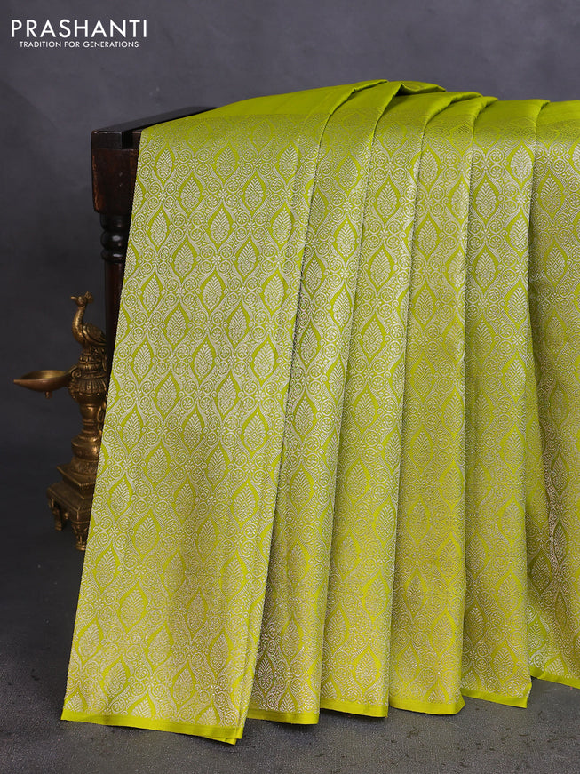 Pure kanchipuram silk saree lime green and navy blue with silver zari woven paisley buttas and long silver zari woven border