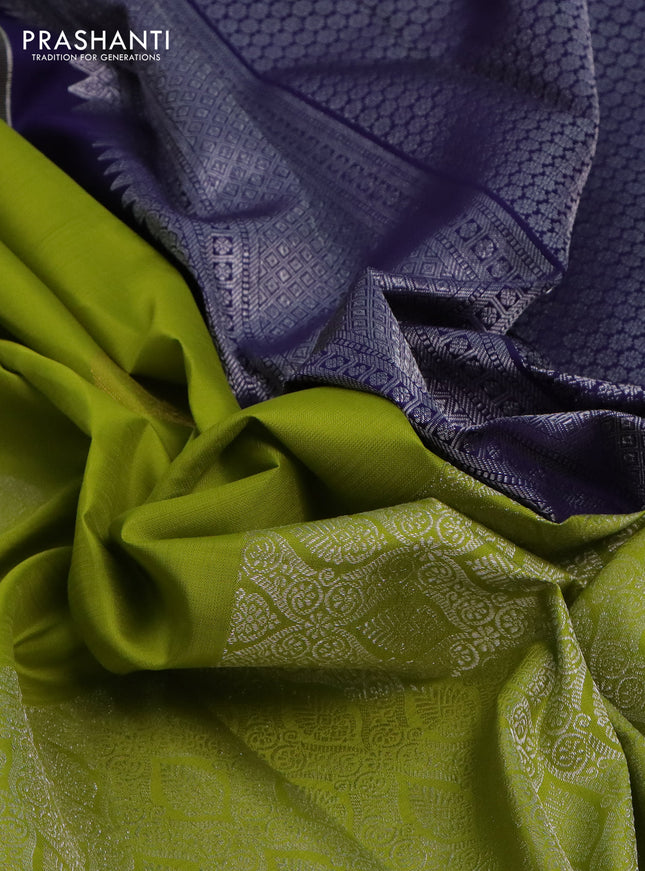 Pure kanchipuram silk saree lime green and navy blue with silver zari woven paisley buttas and long silver zari woven border
