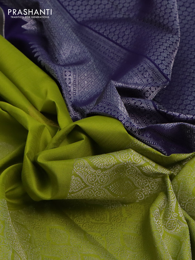 Pure kanchipuram silk saree lime green and navy blue with silver zari woven paisley buttas and long silver zari woven border