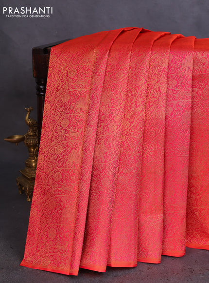 Pure kanchipuram silk saree dual shade of pinkish orange and green with half & half style and long zari woven border