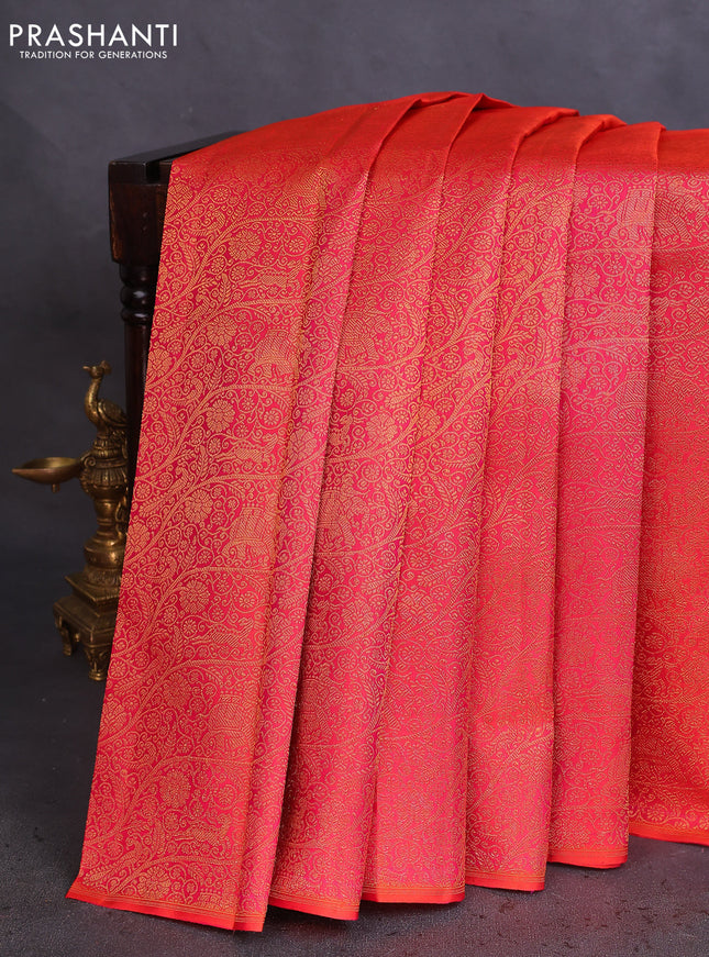 Pure kanchipuram silk saree dual shade of pinkish orange and green with half & half style and long zari woven border