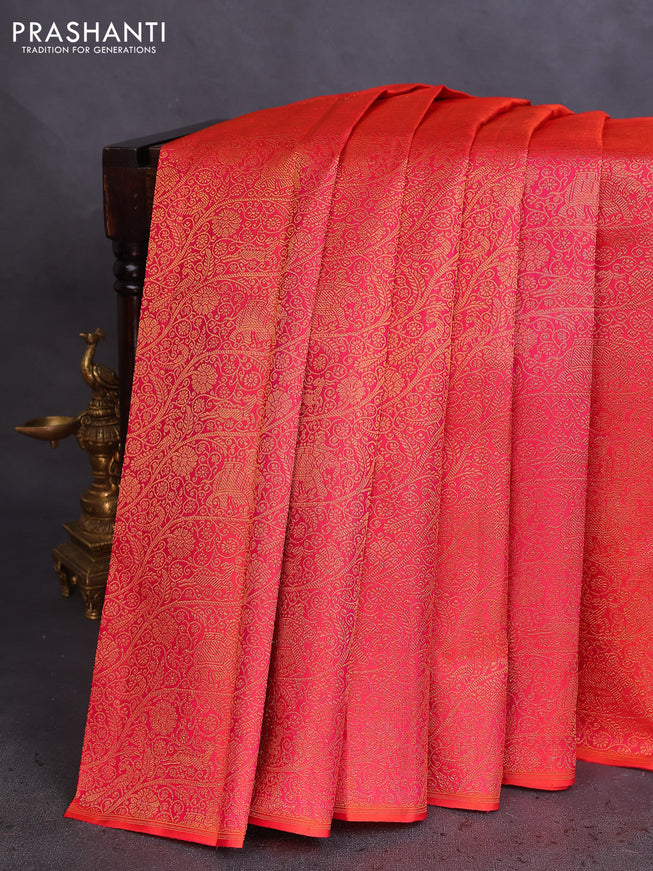Pure kanchipuram silk saree dual shade of pinkish orange and green with half & half style and long zari woven border