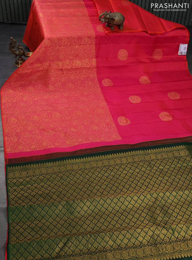 Pure kanchipuram silk saree dual shade of pinkish orange and green with half & half style and long zari woven border