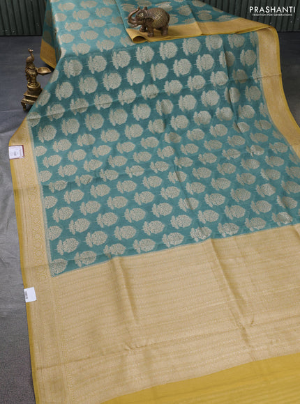 Banarasi silk cotton saree teal green shade and yellow shade with allover thread & zari woven butta weaves and woven border