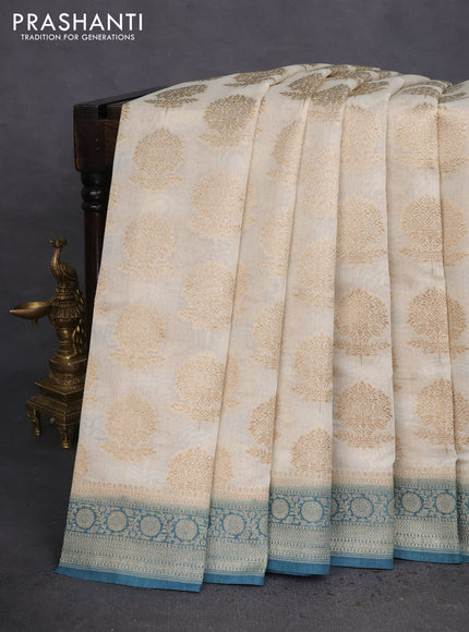 Banarasi silk cotton saree off white and peacock blue with allover thread & zari woven butta weaves and woven border