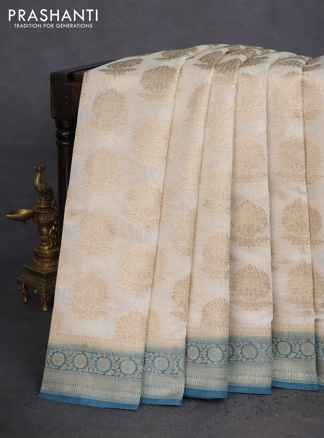 Banarasi silk cotton saree off white and peacock blue with allover thread & zari woven butta weaves and woven border
