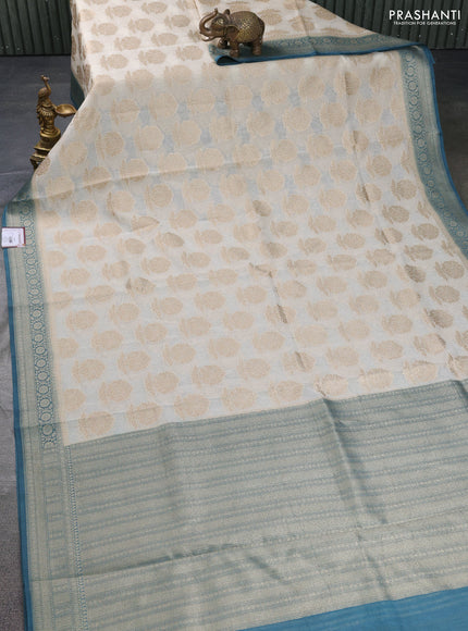 Banarasi silk cotton saree off white and peacock blue with allover thread & zari woven butta weaves and woven border