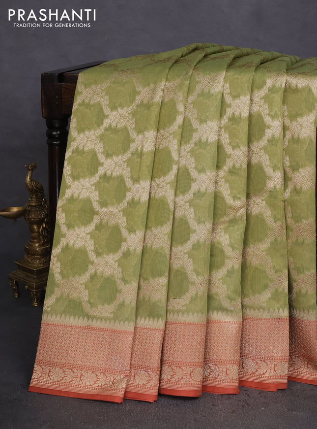 Banarasi silk cotton saree pastel green and rust shade with allover thread & zari weaves and woven border