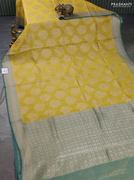 Banarasi tissue silk cotton saree mustard yellow and pastel green with allover thread & zari woven butta weaves and woven border