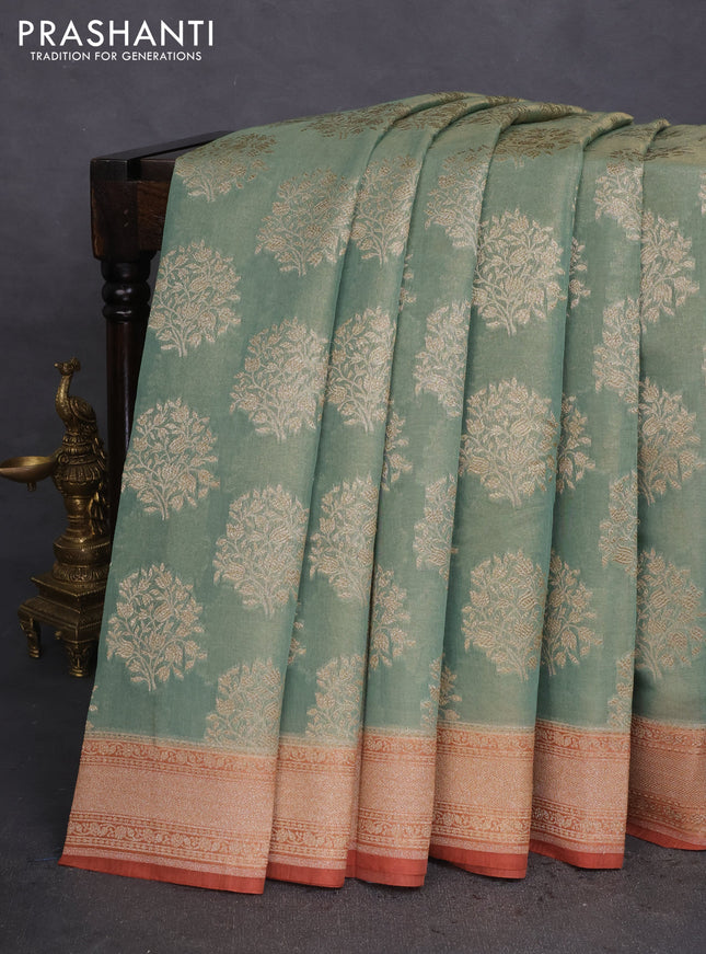 Banarasi tissue silk cotton saree pastel green and rust shade with allover thread & zari woven butta weaves and woven border