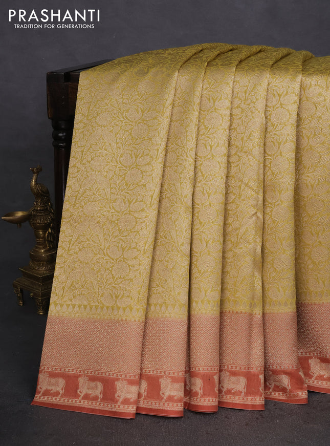 Banarasi silk cotton saree lime yellow and rust shade with allover zari woven brocade weaves and woven border