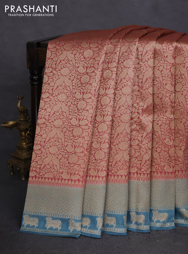 Banarasi silk cotton saree pastel maroon and pastel blue with allover zari woven brocade weaves and woven border