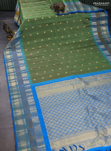 Pure gadwal silk saree green shade and cs blue with zari woven buttas and rettapet annam zari woven border