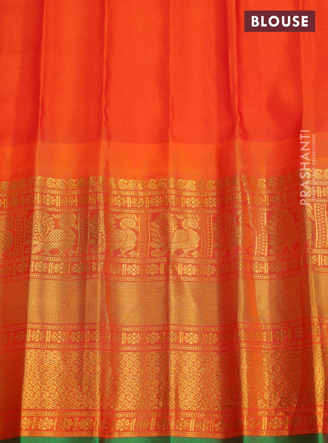 Pure gadwal silk saree light green and orange with annam zari woven buttas and temple design zari woven border