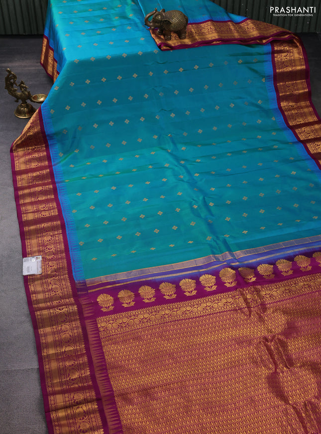 Pure gadwal silk saree dual shade of teal blue and purple with zari woven buttas and temple design zari woven border