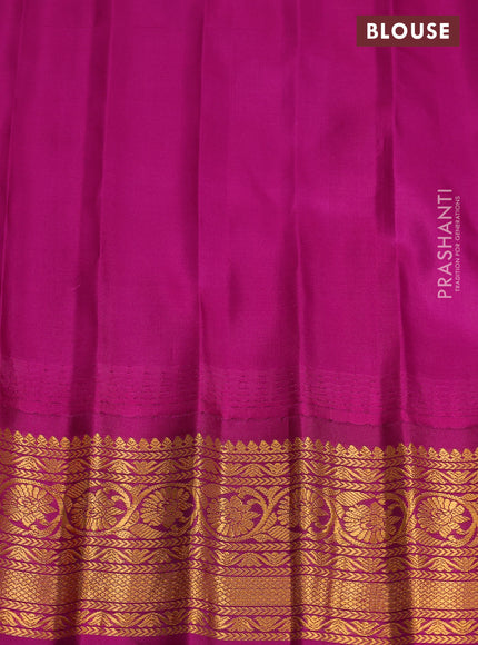 Pure gadwal silk saree dual shade of teal blue and purple with zari woven buttas and temple design zari woven border