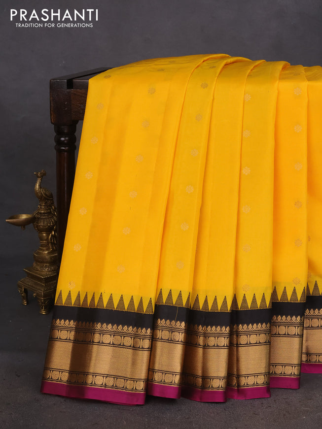 Pure gadwal silk saree yellow and black with zari woven buttas and temple design zari woven border
