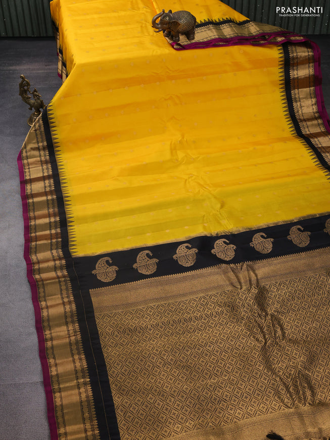 Pure gadwal silk saree yellow and black with zari woven buttas and temple design zari woven border