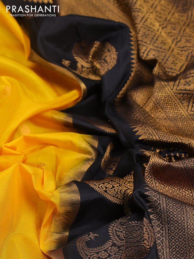 Pure gadwal silk saree yellow and black with zari woven buttas and temple design zari woven border