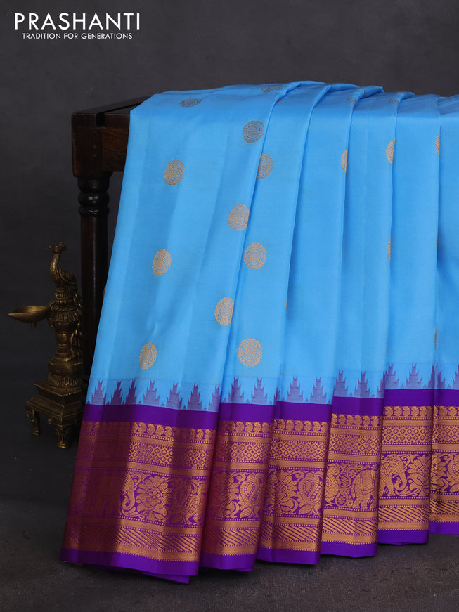 Pure gadwal silk saree light blue and violet with zari woven buttas and temple design zari woven border