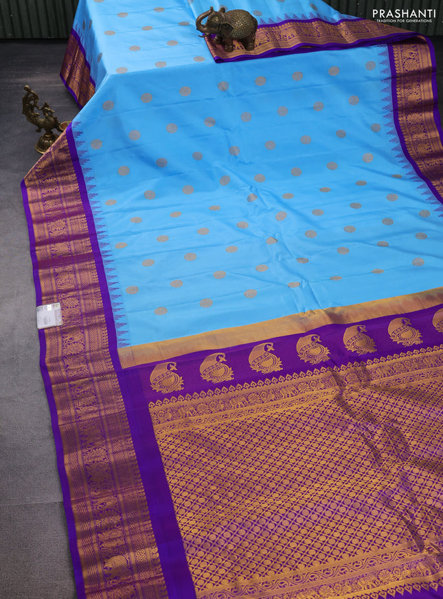 Pure gadwal silk saree light blue and violet with zari woven buttas and temple design zari woven border