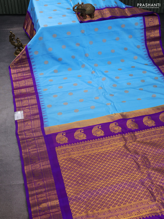 Pure gadwal silk saree light blue and violet with zari woven buttas and temple design zari woven border