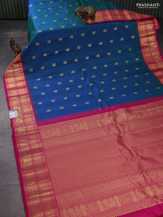 Pure gadwal silk saree dual shade of bluish green and pink with annam zari woven buttas and temple design zari woven border
