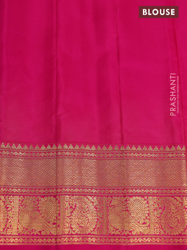 Pure gadwal silk saree dual shade of bluish green and pink with annam zari woven buttas and temple design zari woven border
