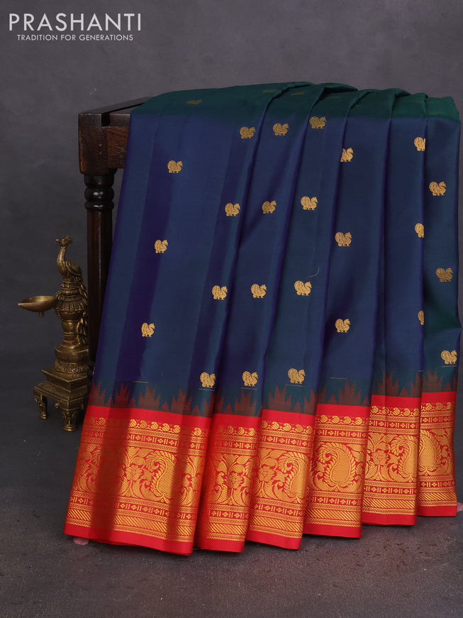 Pure gadwal silk saree dual shade of bluish green and red with annam zari woven buttas and temple design zari woven border