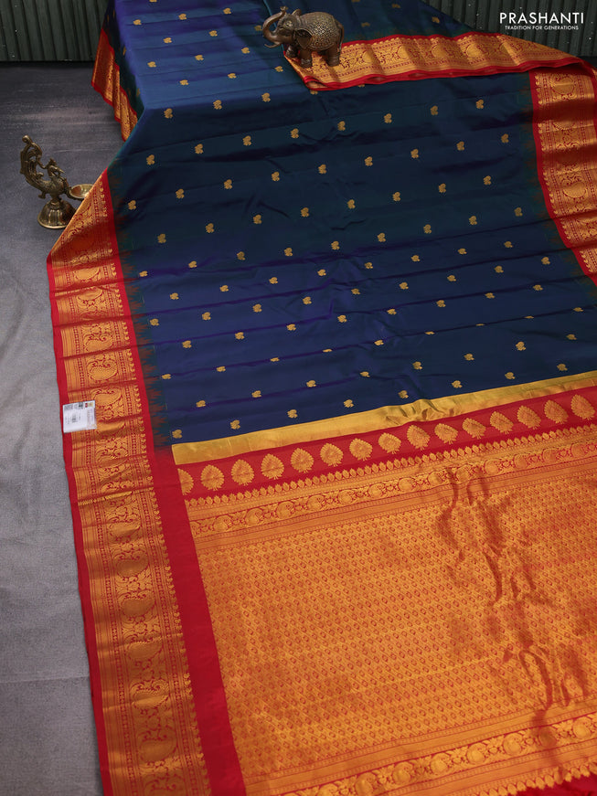 Pure gadwal silk saree dual shade of bluish green and red with annam zari woven buttas and temple design zari woven border