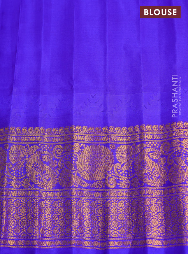 Pure gadwal silk saree red and blue with annam zari woven buttas and long rettapet zari woven border