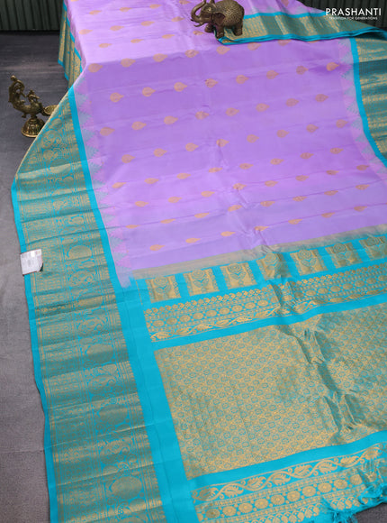 Pure gadwal silk saree lavender shade and teal green with zari woven buttas and temple design zari woven border