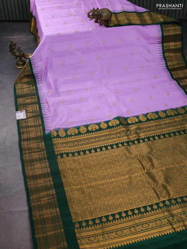 Pure gadwal silk saree lavender shade and green with zari woven buttas and temple design zari woven border