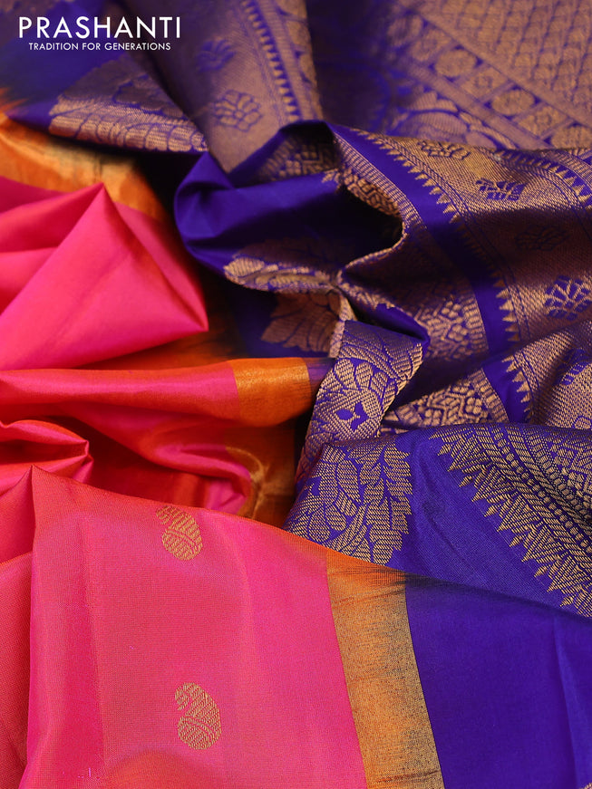 Pure gadwal silk saree dual shade of pinkish orange and blue with zari woven buttas and temple design zari woven border