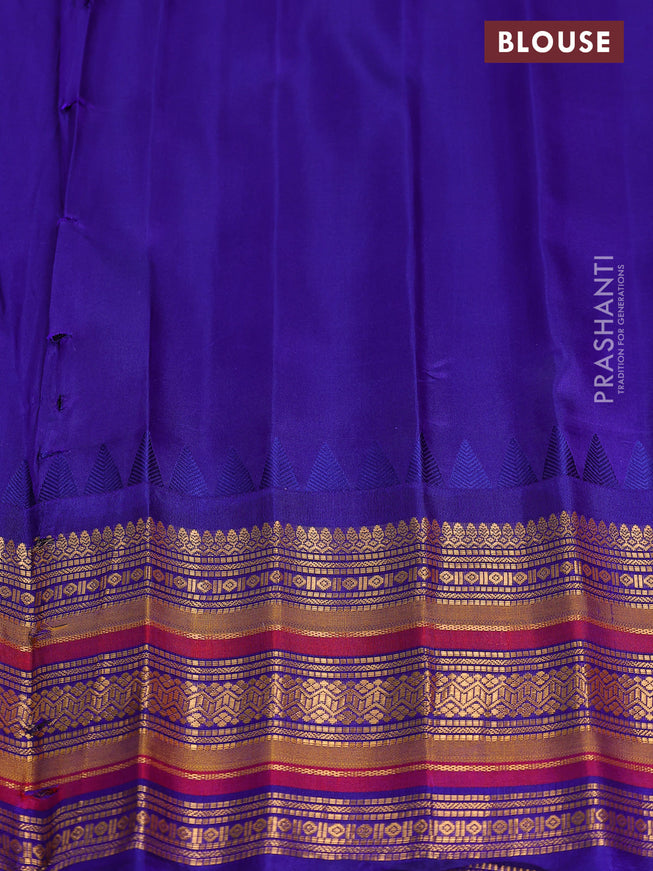 Pure gadwal silk saree dual shade of pinkish orange and blue with zari woven buttas and temple design zari woven border