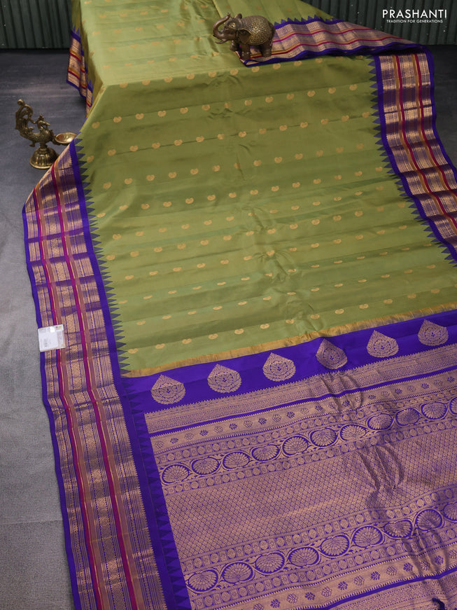 Pure gadwal silk saree mehendi green and blue with zari woven buttas and temple design zari woven border