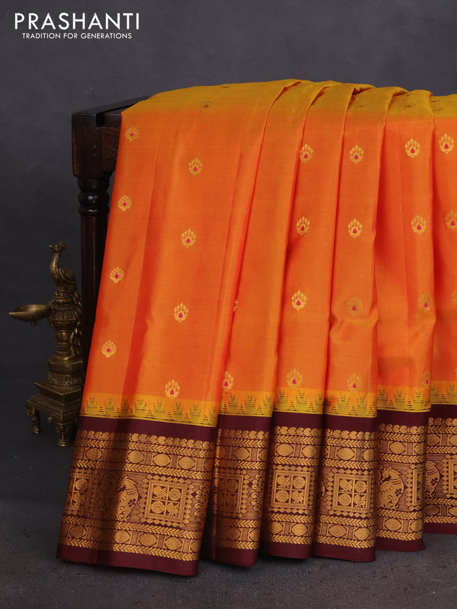 Pure gadwal silk saree dual shade of mustard yellow and deep maroon with zari woven buttas and temple design zari woven border