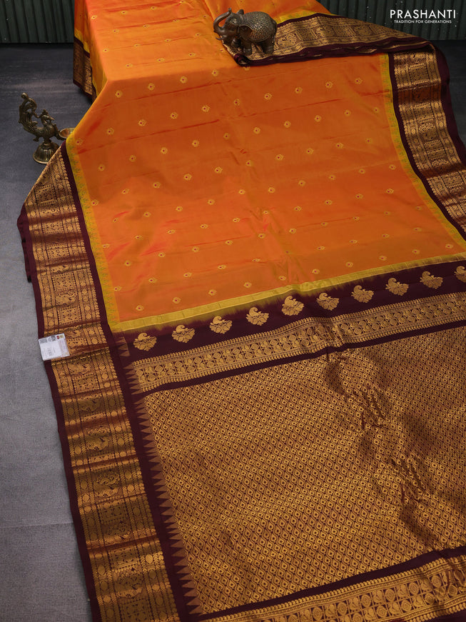 Pure gadwal silk saree dual shade of mustard yellow and deep maroon with zari woven buttas and temple design zari woven border