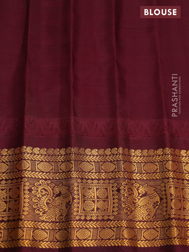 Pure gadwal silk saree dual shade of mustard yellow and deep maroon with zari woven buttas and temple design zari woven border