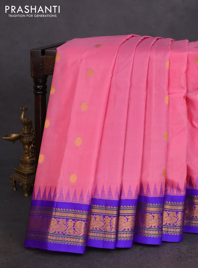 Pure gadwal silk saree light pink and blue with zari woven buttas and temple design zari woven border