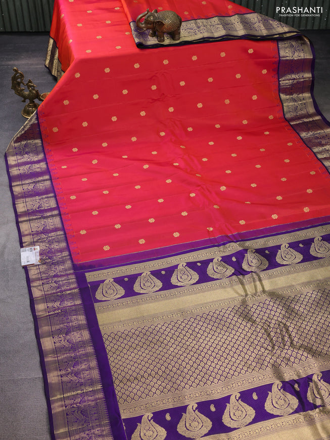 Pure gadwal silk saree dual shade of pinkish orange and deep violet with zari woven buttas and temple design zari woven border