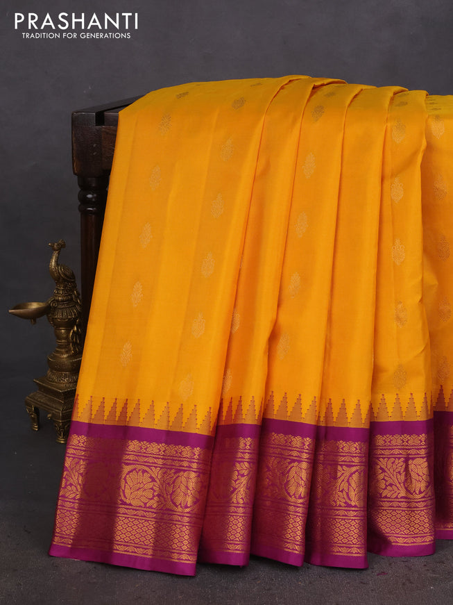 Pure gadwal silk saree mango yellow and purple with zari woven buttas and temple design zari woven border