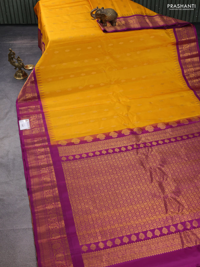 Pure gadwal silk saree mango yellow and purple with zari woven buttas and temple design zari woven border