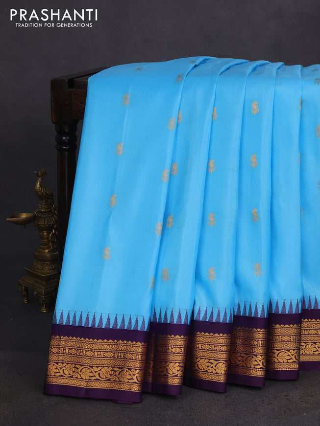 Pure gadwal silk saree light blue and deep violet with zari woven buttas and temple design zari woven border